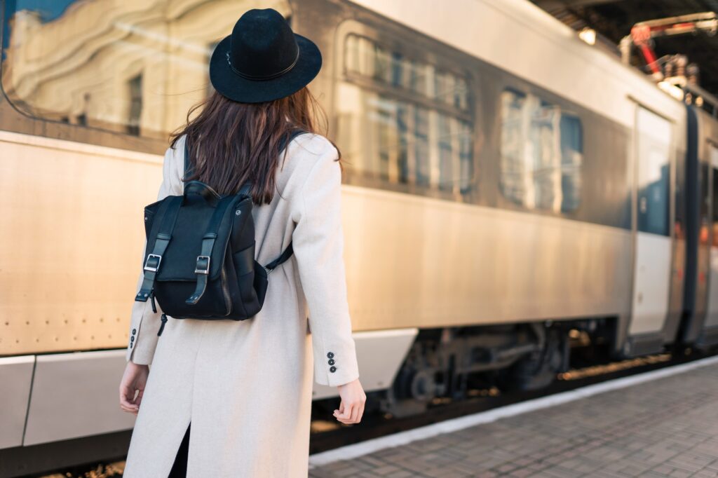 Tourist girl at railway station platform